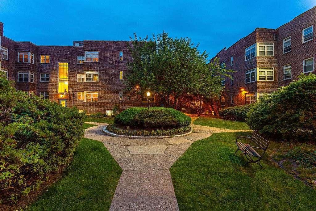 Beautifully landscaped courtyard at Sedgwick Gardens apartments for rent in Philadelphia, PA